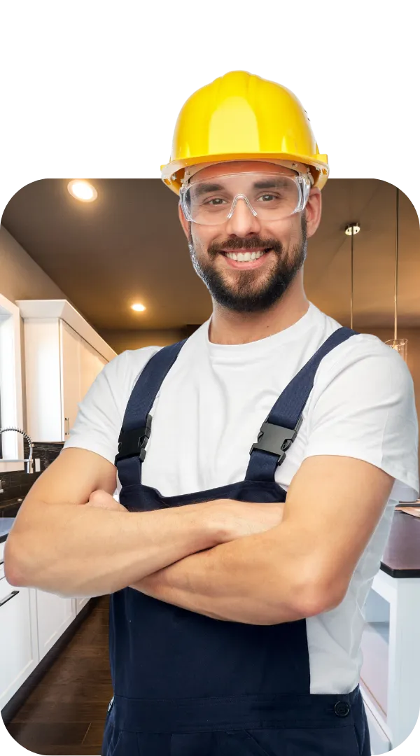 Los Angeles remodeling contractor wearing a yellow hard hat and safety glasses during a kitchen renovation project.